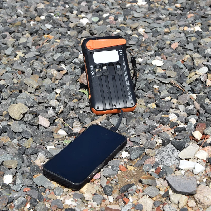 Powerbank All-in-One - 10000 mAh - Notfall-Solar-Panel & Handkurbel - 1 x USB A - integrierte Kabel - LED - Status-LED - schwarz / orange